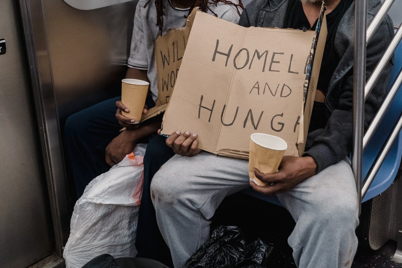 A poignant image capturing the realities of homelessness on public transportation.